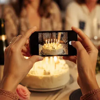 Birthday cake with lit candles